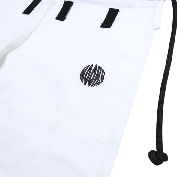Close-up of white fabric with black ‘HOOKS’ stylized lettering and drawstrings, part of martial arts attire