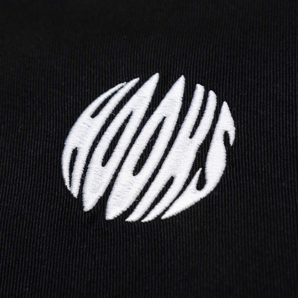 White embroidered Hooks logo on dark fabric, featuring abstract spherical design with precise stitching.